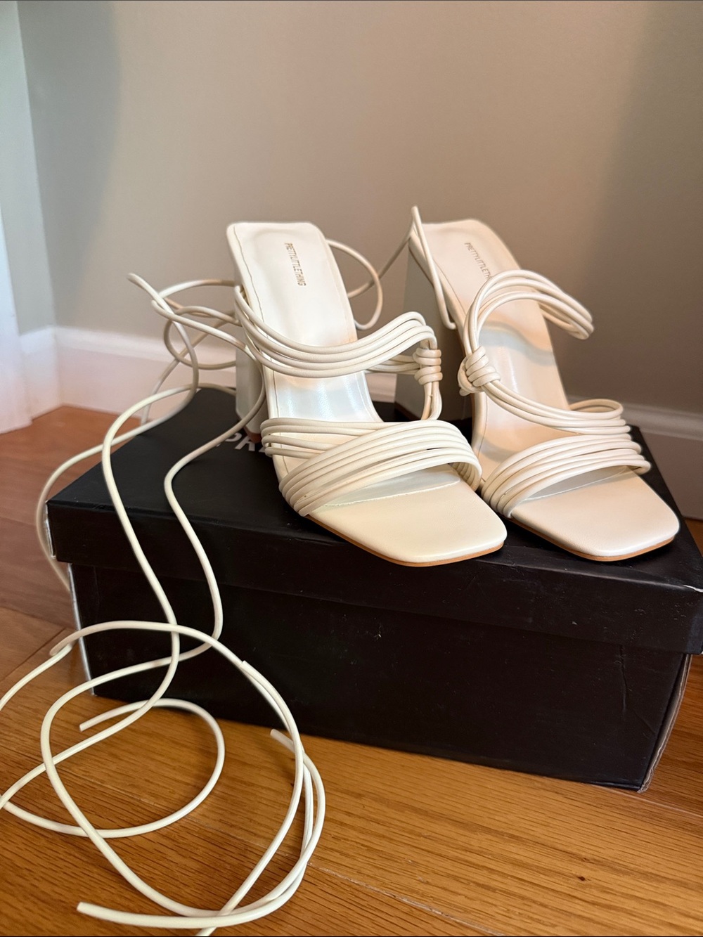 Strappy cream lace up block heels